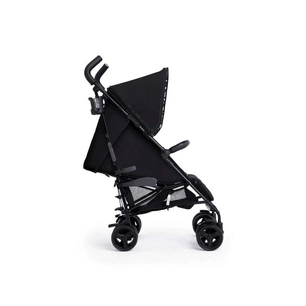 Folded black stroller with canopy extended, side view with 4 small wheels