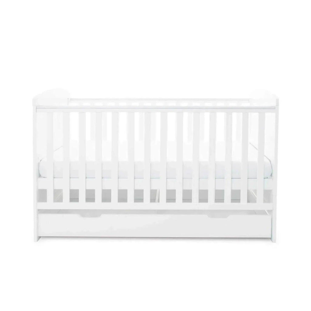 White cot bed with under drawer, front view with grey drawer handle accents