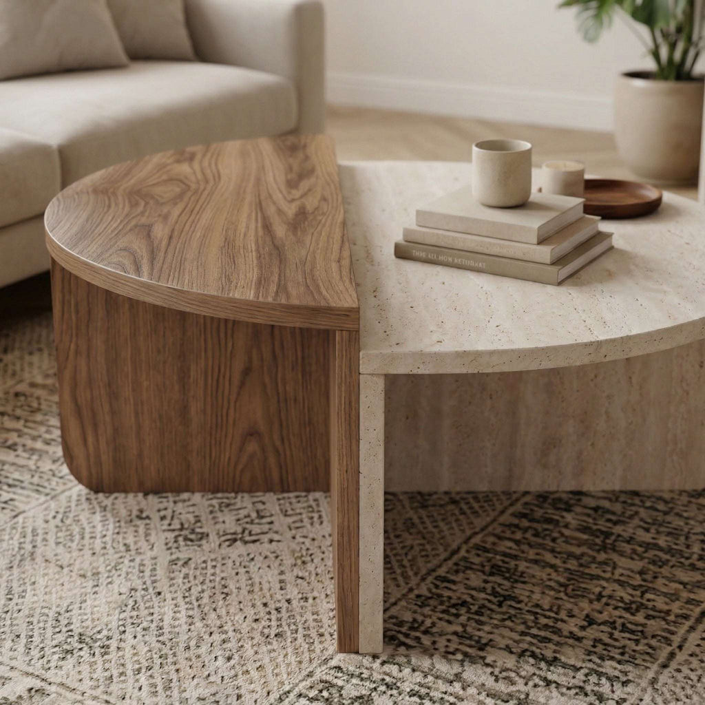 Modern round coffee table close view: light travertine top with dark wood base
