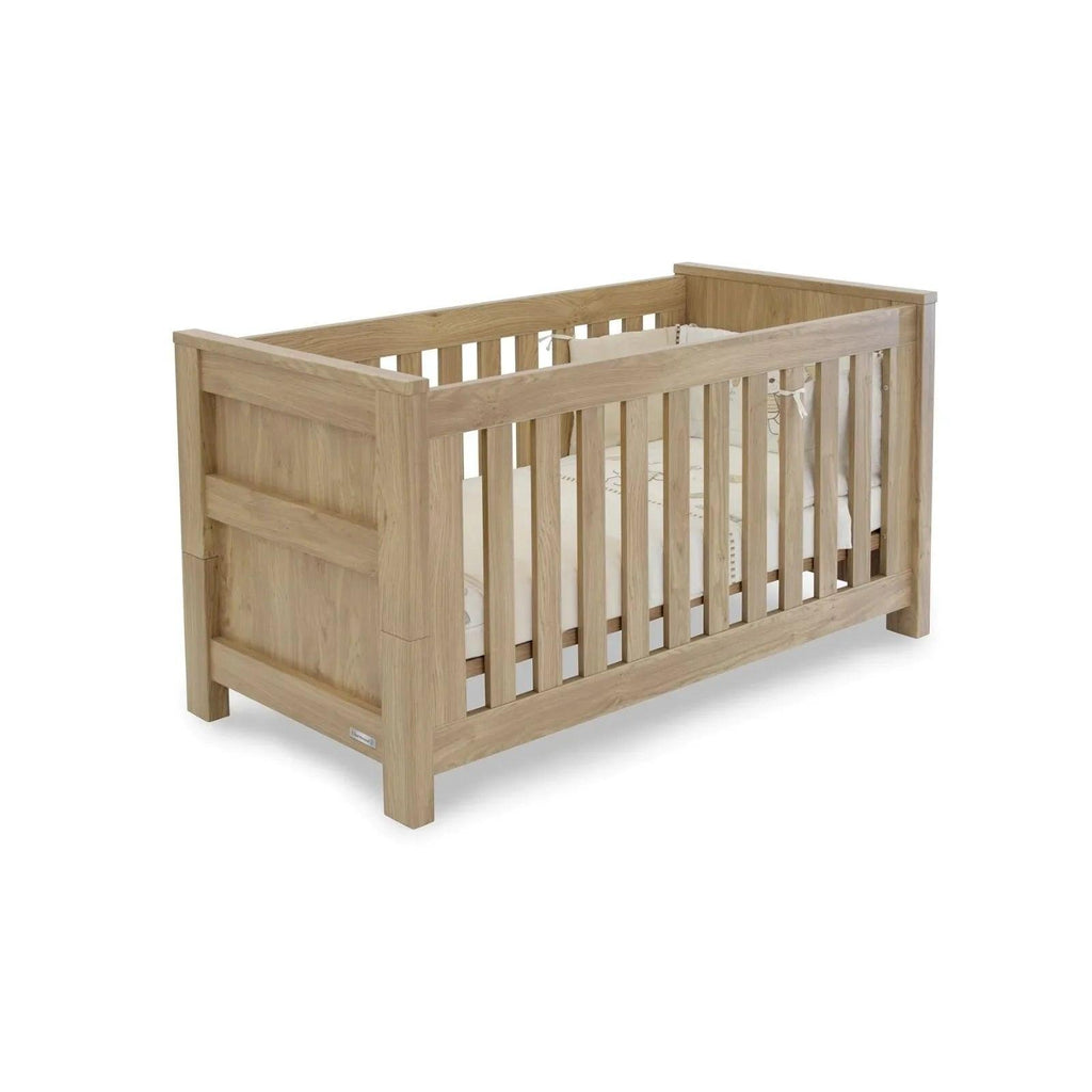 Oak cot bed with vertical slat sides and low foot and head rails