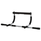 Standalone doorway pull-up bar with black foam handles and curved silver frame