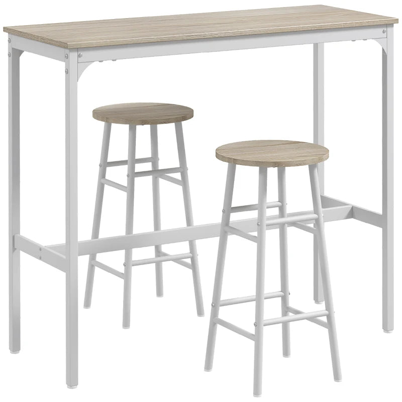 Industrial bar table with two light oak-tone stools and white metal frame.