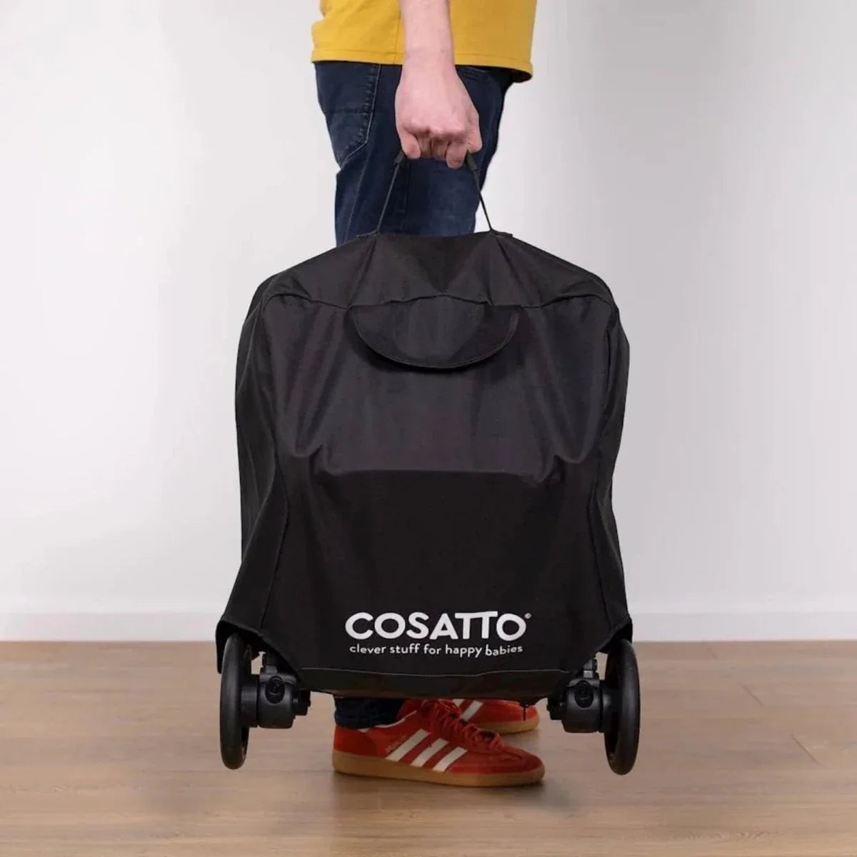Black stroller bag with rear hood pocket, Cosatto logo, and wheel mounts