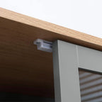 Grey pantry cupboard with light wood top and metal support bracket