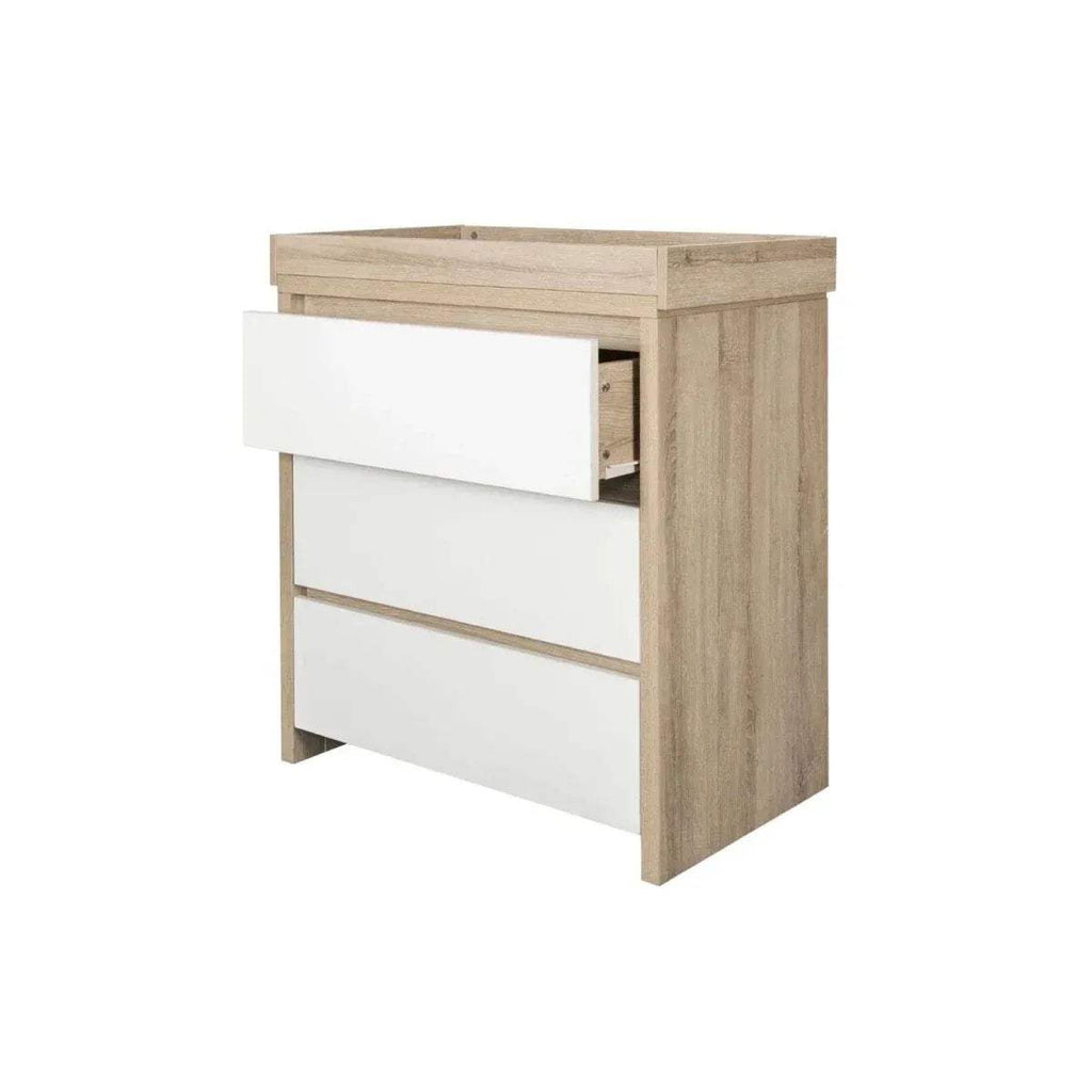 Light oak and white changing unit with drawer pulled open for storage