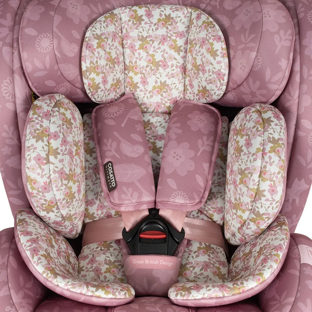 Cosatto i-Size car seat interior with pink floral pads, harness, and buckle
