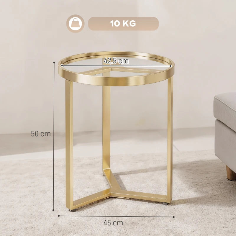 Gold round side table with geometric metal legs and clear glass top, gold tone