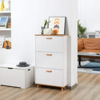 White slim shoe cabinet with three drawers and wood-tone handles on legs
