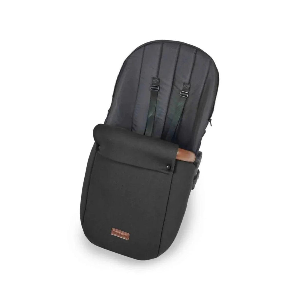 Dark stroller carrycot with black padded seat liner and buckle straps