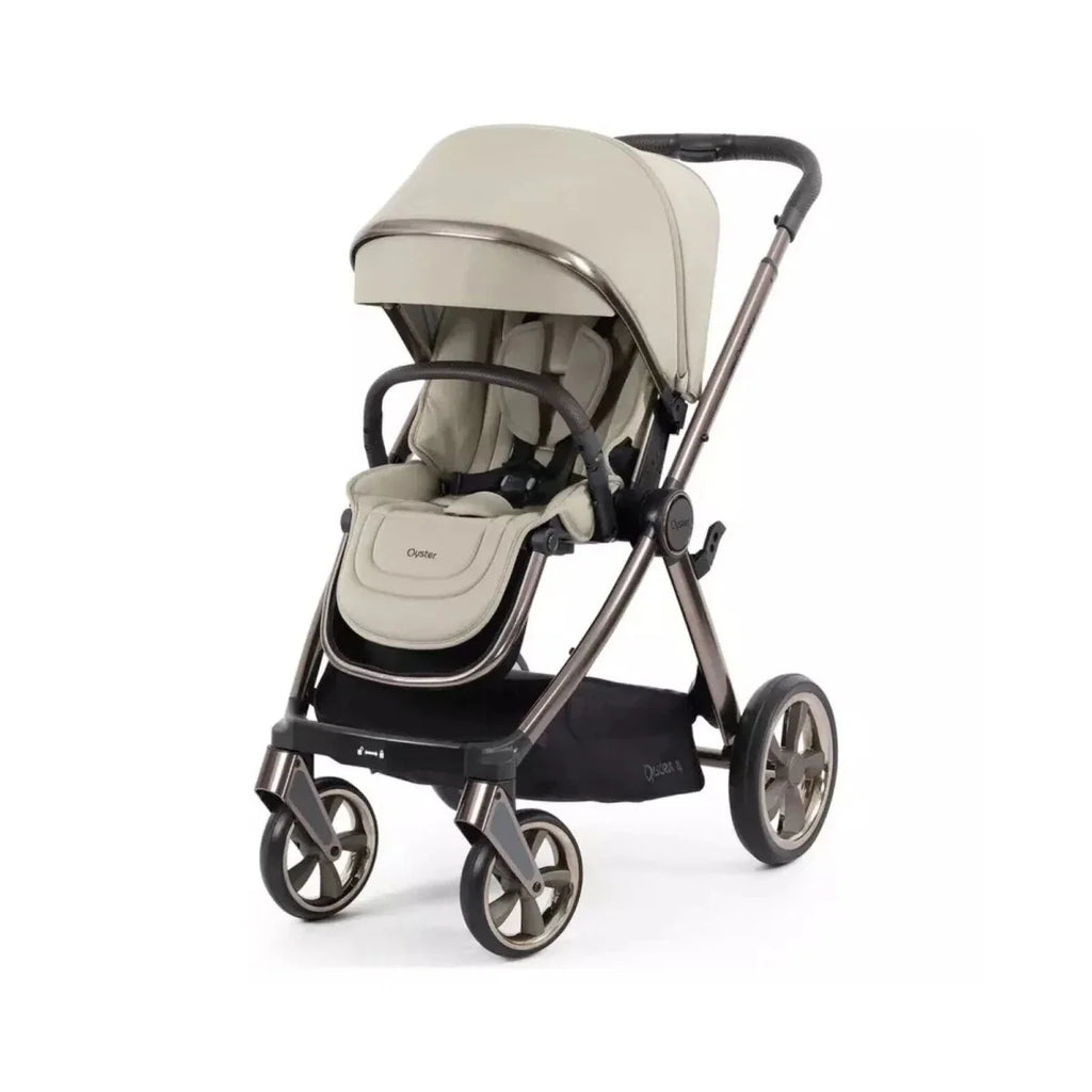 Buttermilk single pushchair stroller with beige hood and black wheels, front seat view