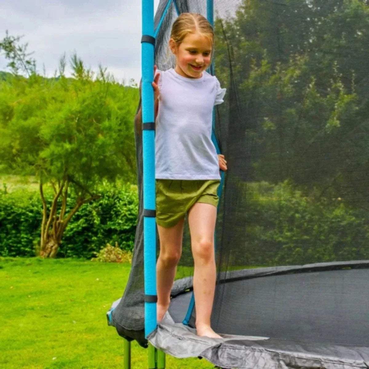 Trampoline with blue padded pole and black mesh safety net, round edge and legs