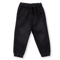 Black denim baby trousers with elastic waistband and tapered legs