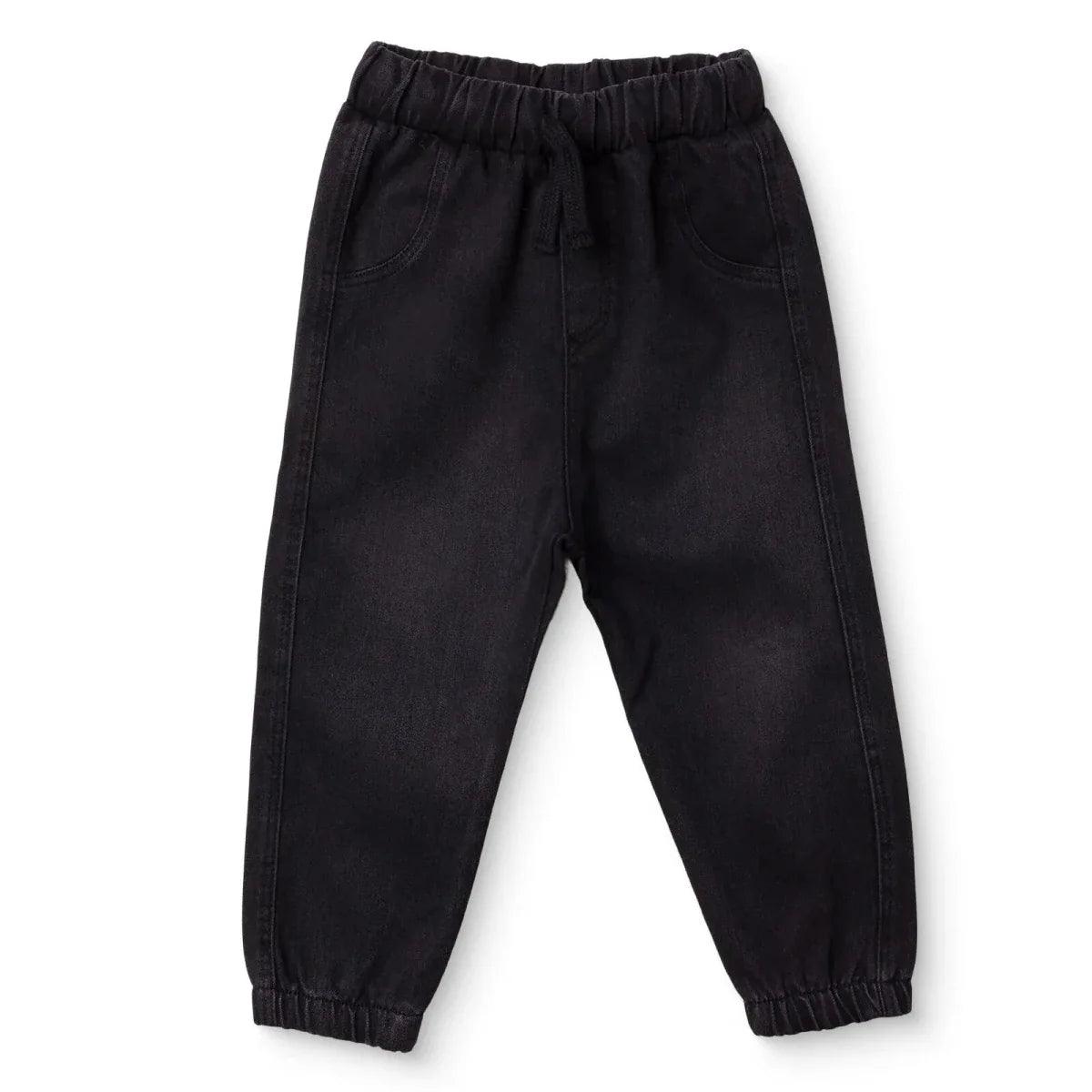 Black denim baby trousers with elastic waistband and tapered legs