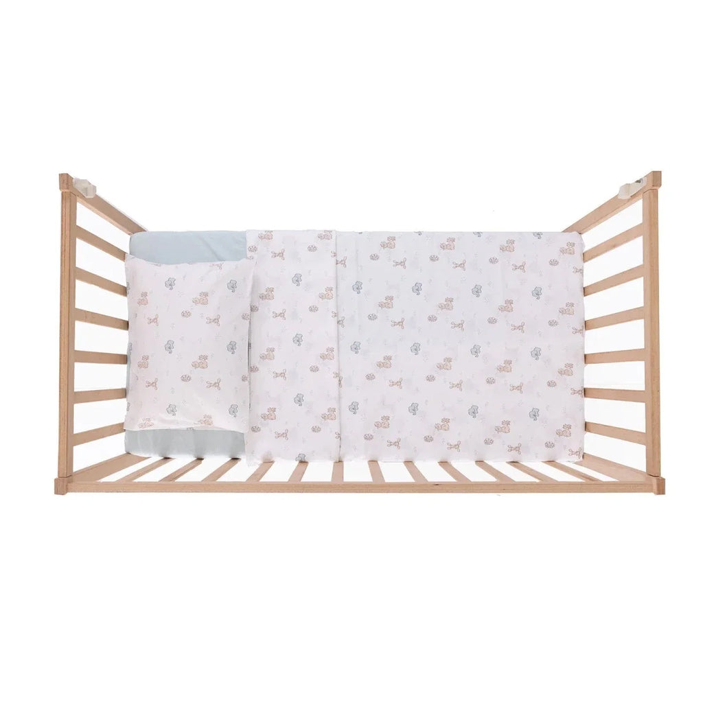 Duvet cover and pillowcase set featuring pale blue and beige animal print