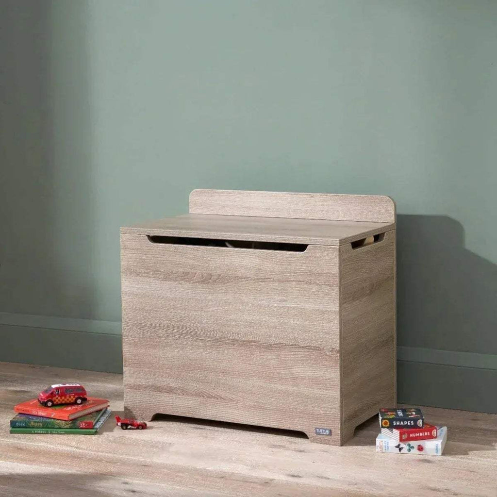 Oak wooden toy box with flip-top lid and front handhold slot