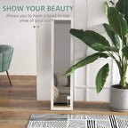 White full-length mirror with rectangular frame, leaning against the wall indoors