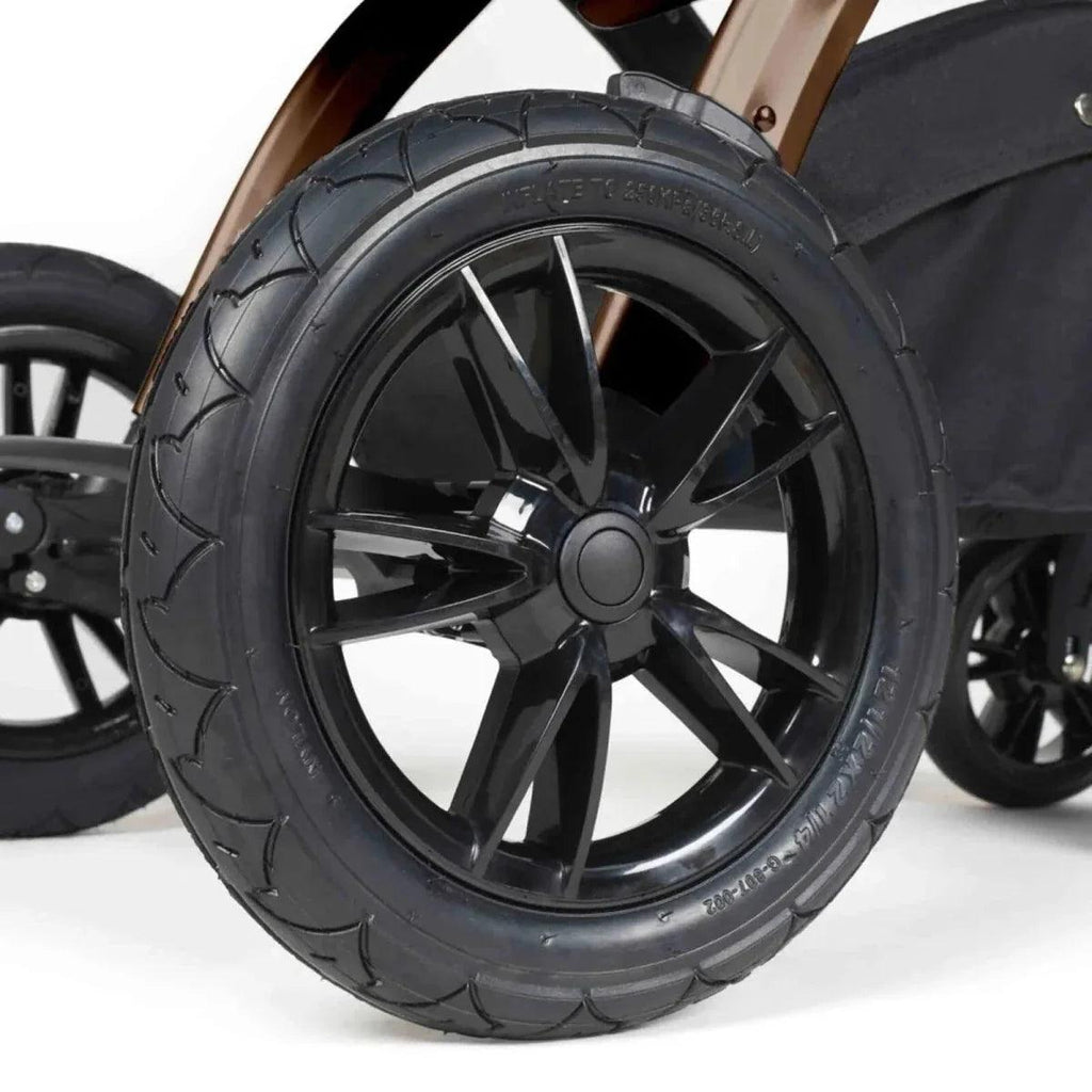 Black stroller wheel with multi-spoke rim and textured tire
