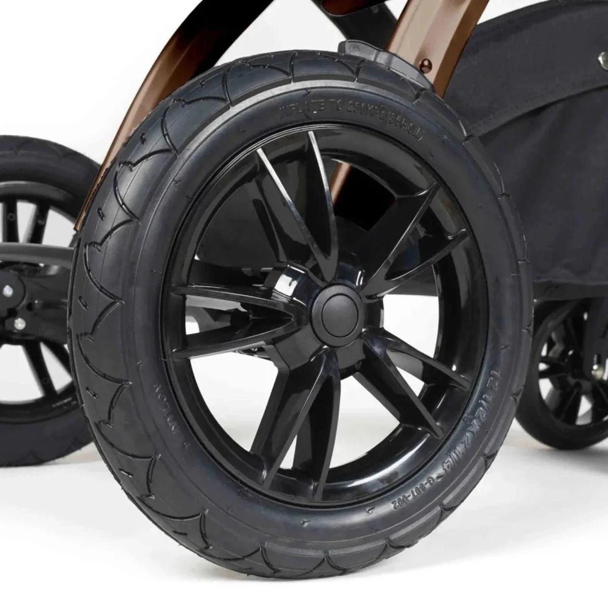Black stroller wheel with multi-spoke rim and textured tire