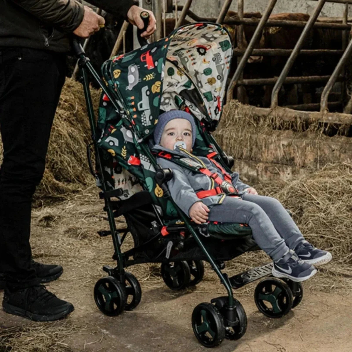 Patterned stroller seat with toddler, safety harness and five-point legs
