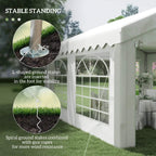 White party tent canopy with arched windows and ground stakes for stability