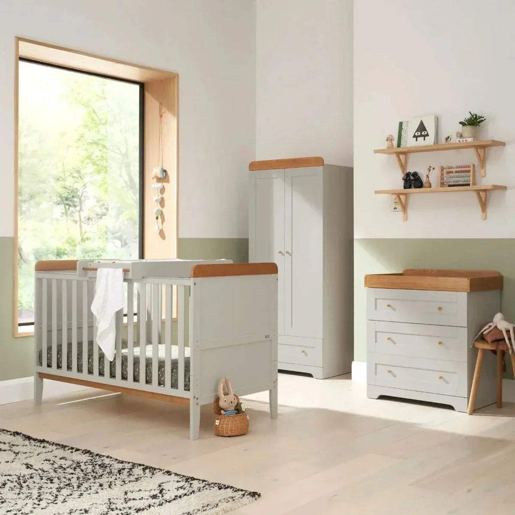 Baby chest changer with light wood top and white drawers