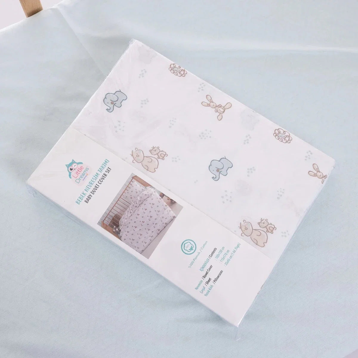 Duvet cover set packaging view showing light blue and beige animal print on white