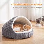 Grey plush cat cave house with arched hood; cat resting inside