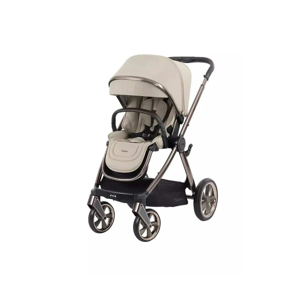 Buttermilk stroller with beige seat, canopy, and black frame, shown front-side