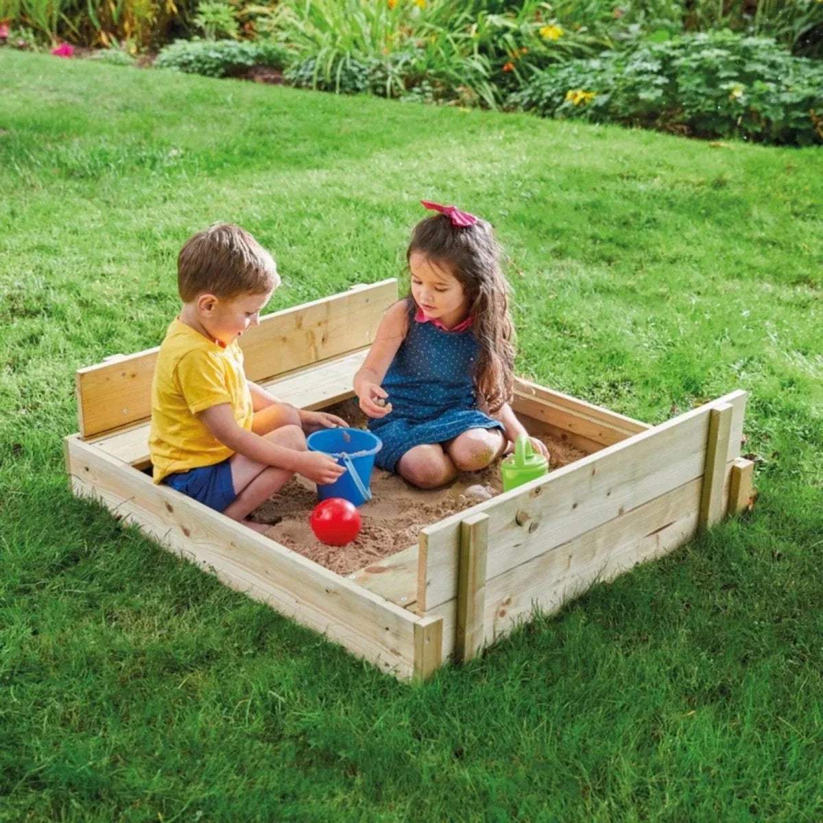 Wooden lidded sandpit with open side panels; two children playing with sand