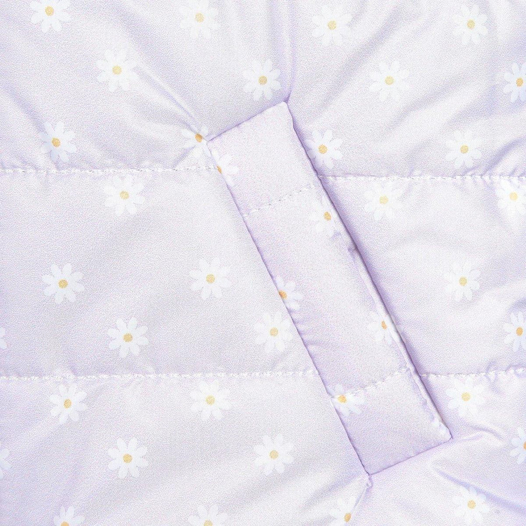 Lilac baby vest with small yellow daisies, front yoke seam, and angled trim