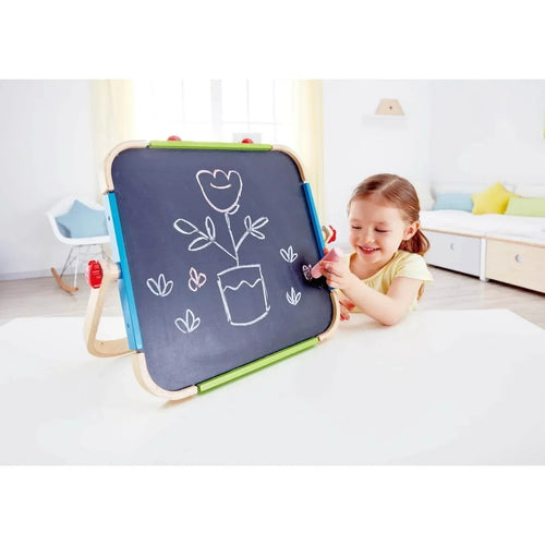 Portable drawing board with dark writing surface, white doodles, wood frame and green border