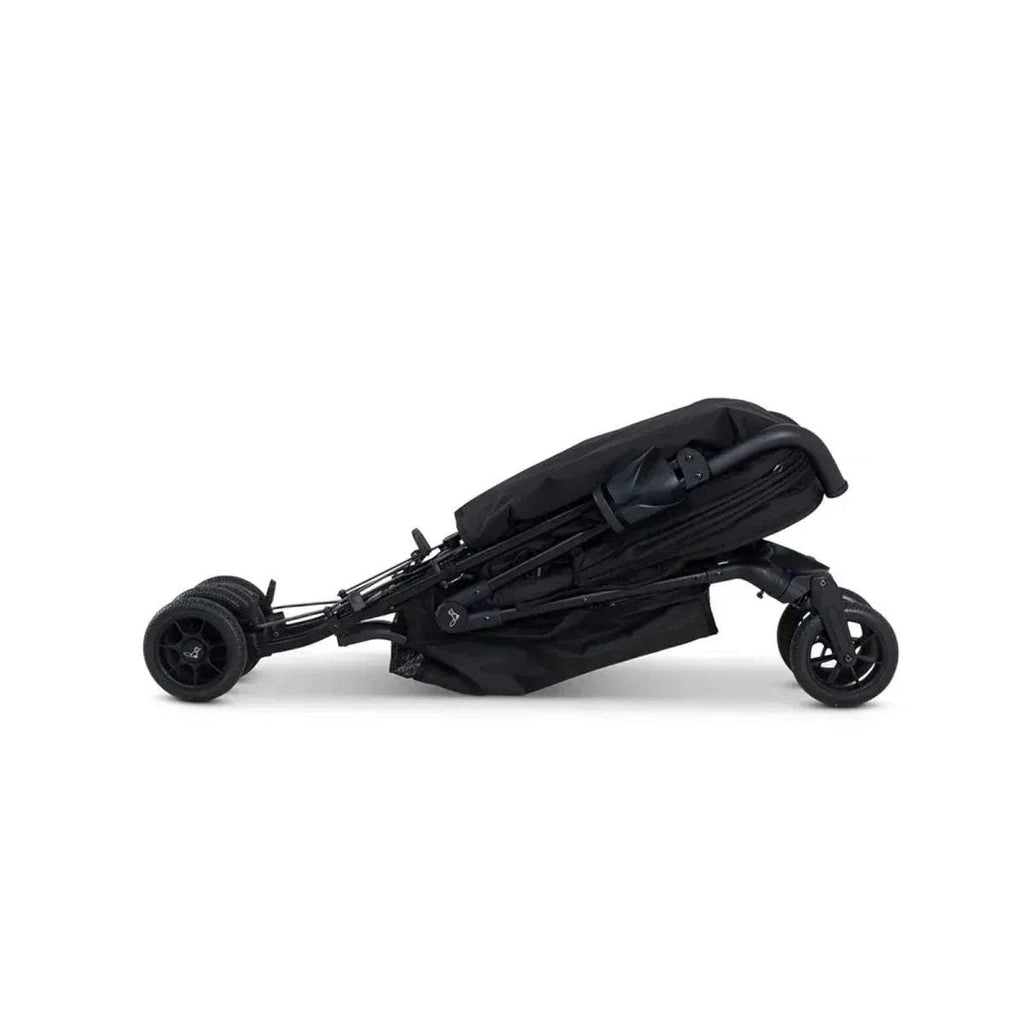Lightweight stroller with black frame and canopy, side low-angle view