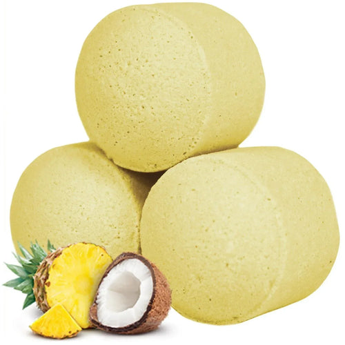 Yellow mini bath bombs with pineapple and coconut pieces