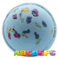 Blue alphabet bath bomb with colorful letter shapes, Aâ€“G on front.