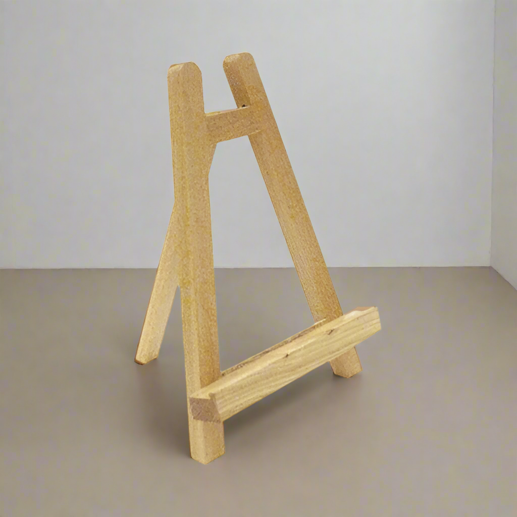 Small wooden easel on a white background