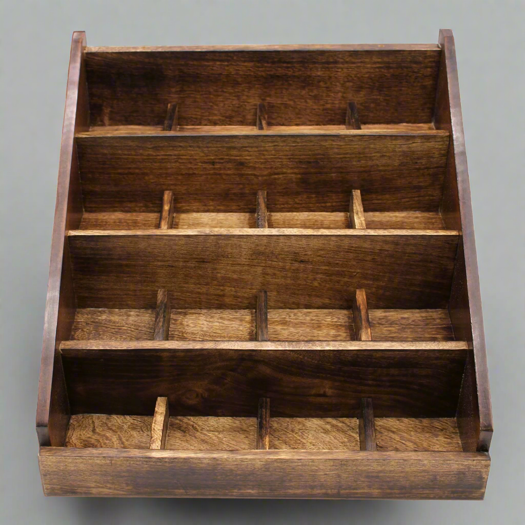 Wooden display rack with multiple compartments on a white background