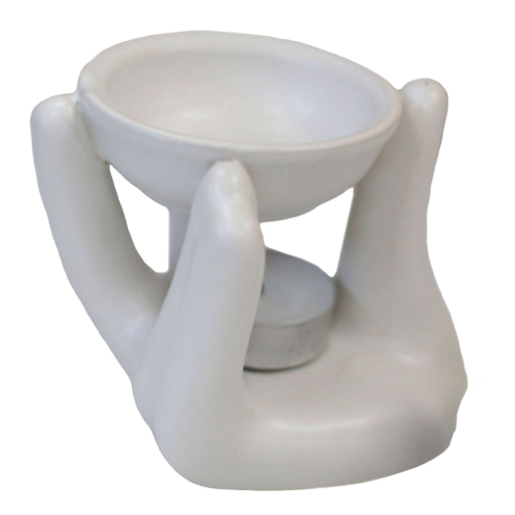 White ceramic oil burner with two bowls on a white background
