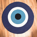 Round cotton rope eye rug with navy, teal, white rings and black center