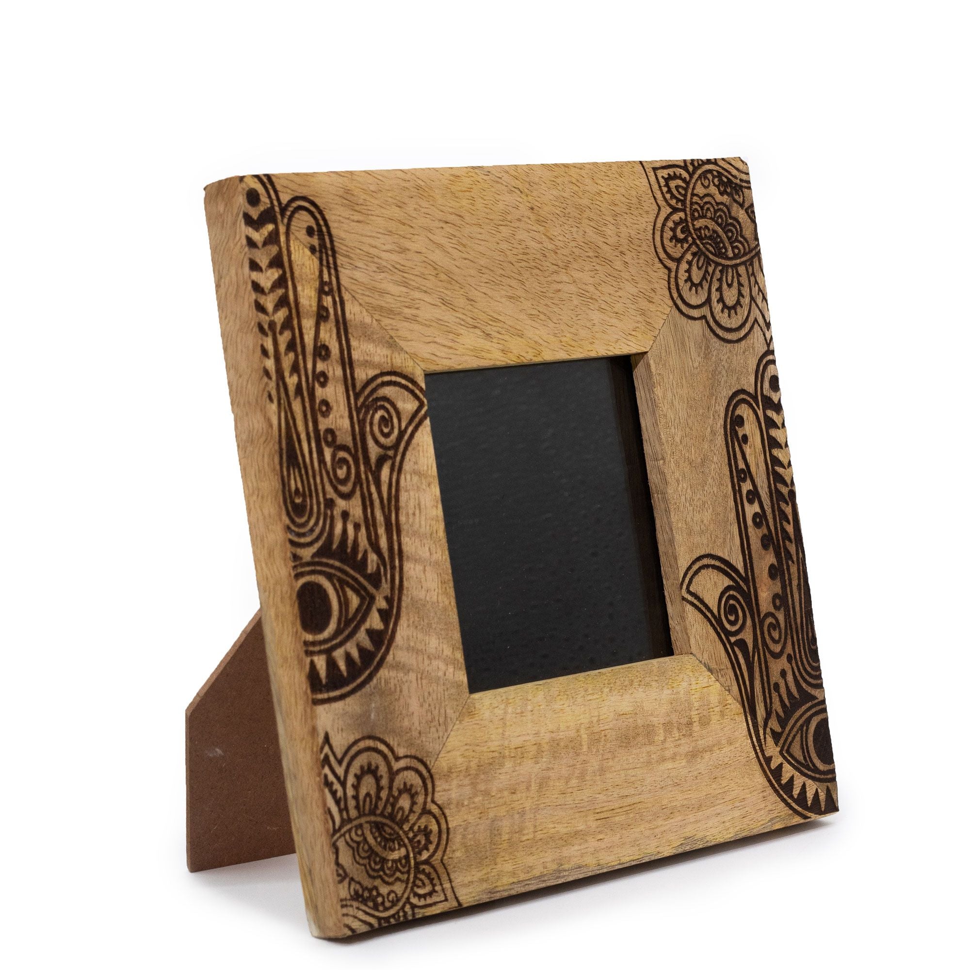 Wooden photo frame with intricate carvings on a white background
