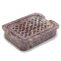 Square soapstone soap dish with raised rim and drain holes on top