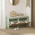 Light green shoe bench with open shoe compartments and padded seat for entryway storage