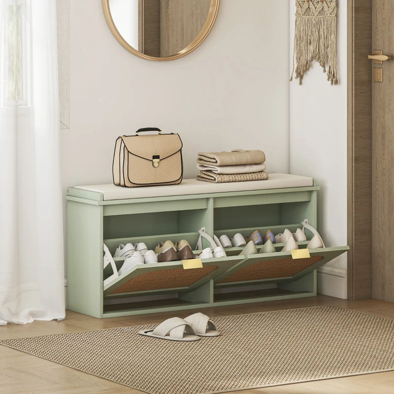 Light green shoe bench with open shoe compartments and padded seat for entryway storage
