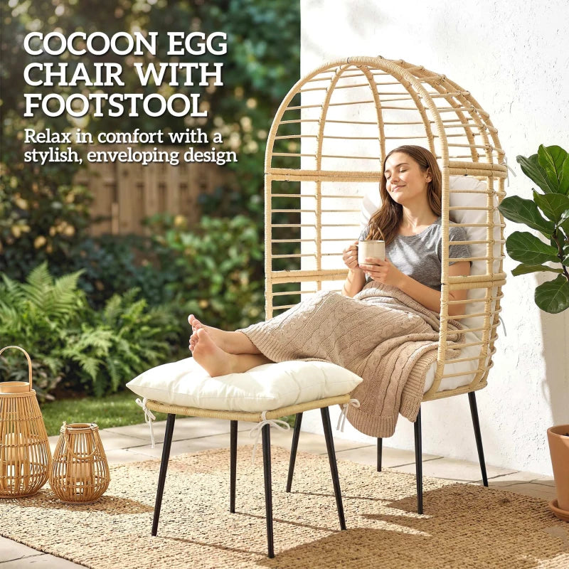 Beige rattan egg chair with white cushions and cushioned footstool for lounging