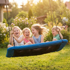 Blue nest swing with four kids riding and holding the hanging ropes outdoors