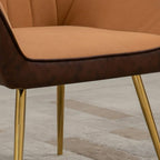 Light brown velvet chair seat with dark trim and gold steel leg detail