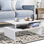 White 2-tier coffee table with open shelf holding books, aluminum legs