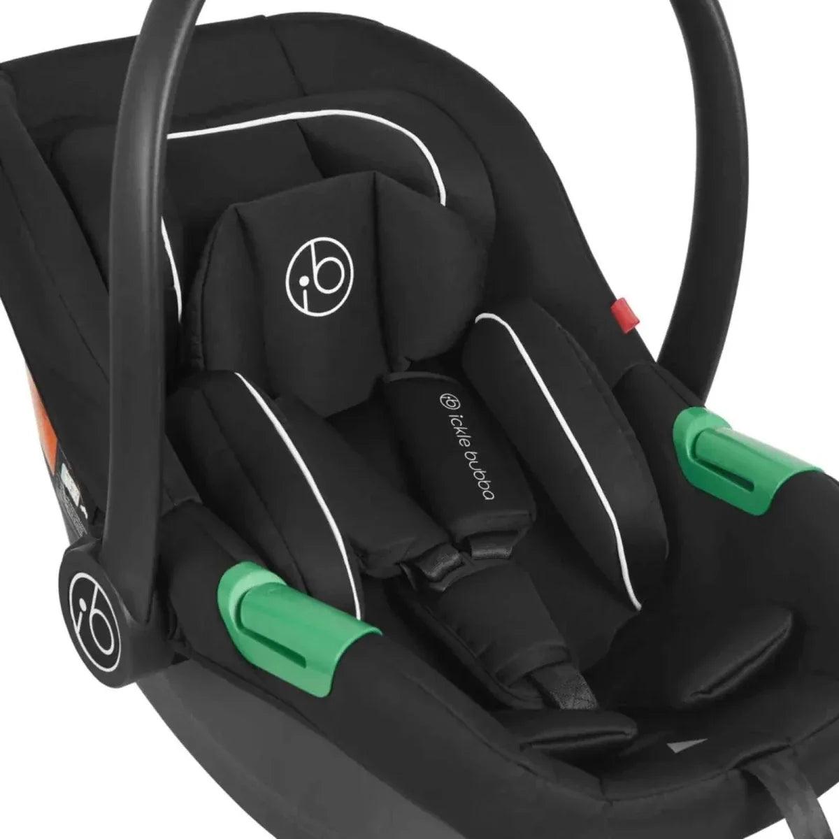 Black i-Size car seat with green latch parts and padded insert with headrest