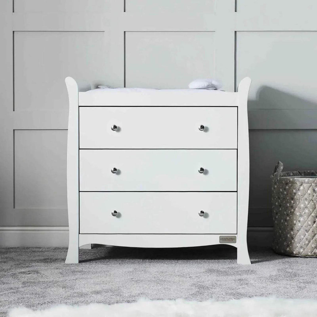 White three-drawer cabinet with metal knobs and curved top