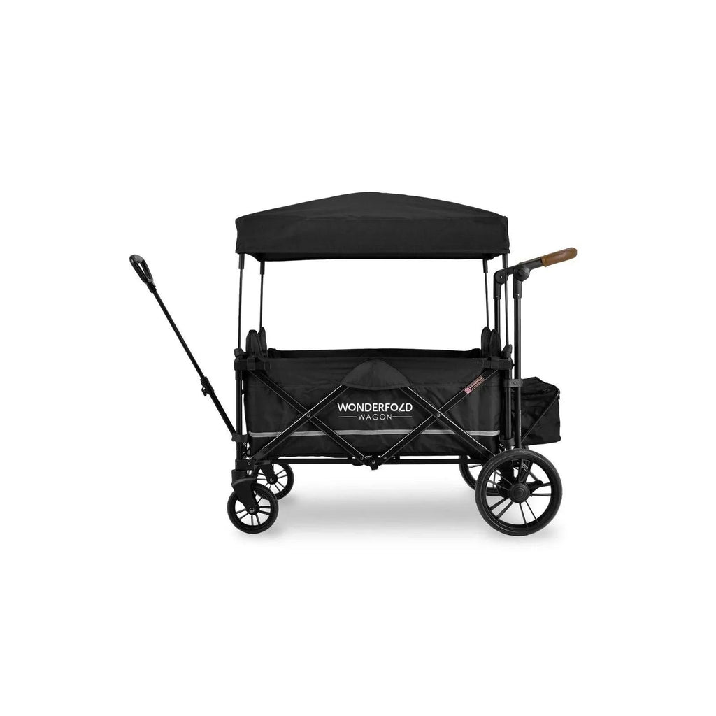 Black quad stroller wagon with canopy and push handle, side view with four wheels