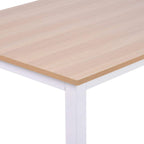 Close view of light wood desktop corner on a white metal desk frame
